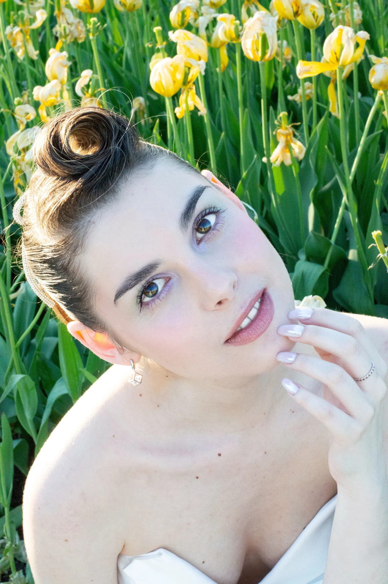 Beauty portrait surrounded by flowers.