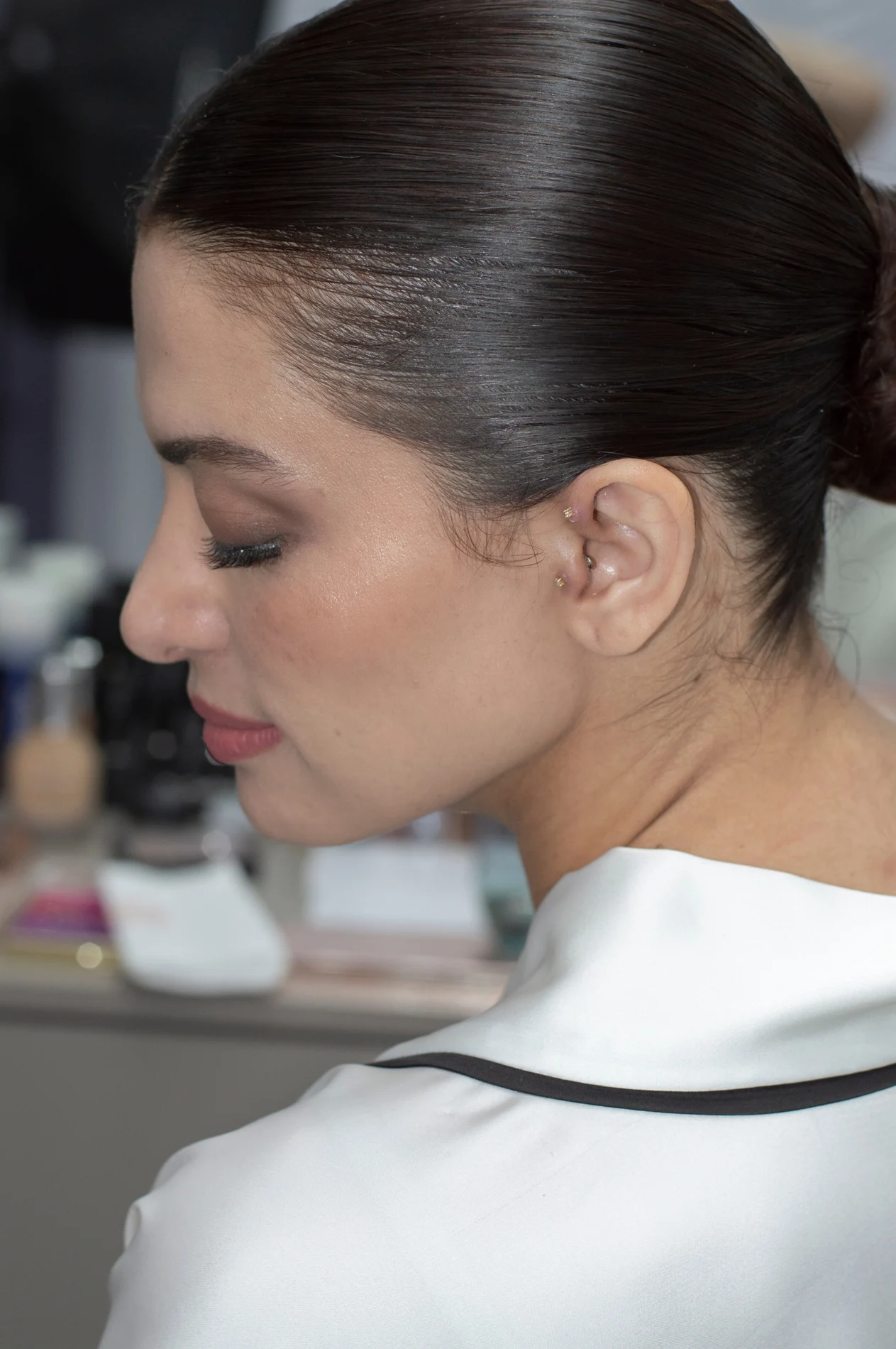 Close view of bridal makeup and an updo.